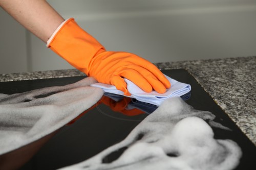 Professional upholstery cleaning service refreshing a sofa in Brixton